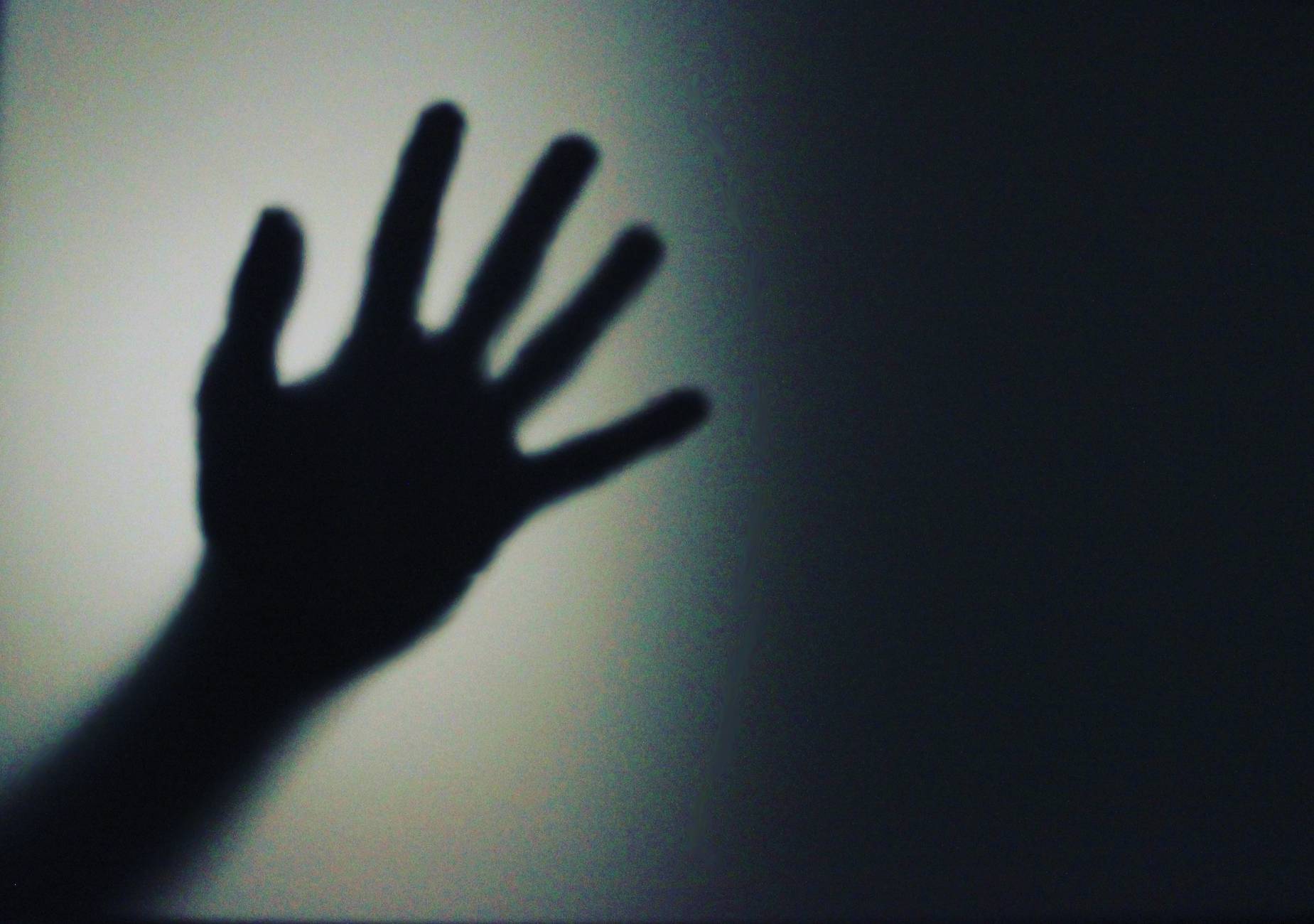 silhouette person s hand